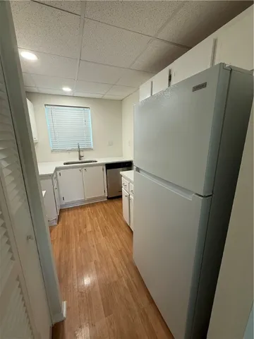 a kitchen with a refrigerator a sink and dishwasher