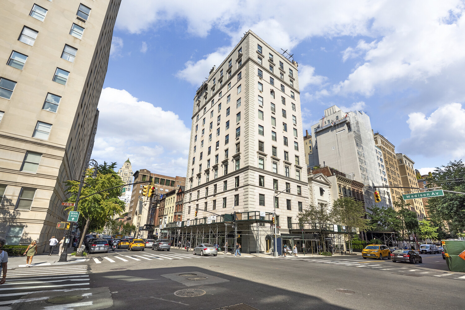 31 East 72nd Street, Unit 2 Manhattan, NY 10021 - Photo 10 of 12 a view of a city street lined with buildings and cars