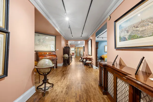 a view of a city street lined with buildings and cars