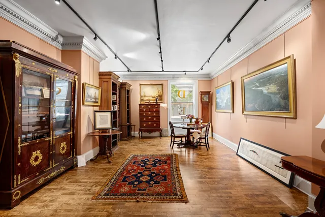 a living room with furniture a air conditioner vent and a window
