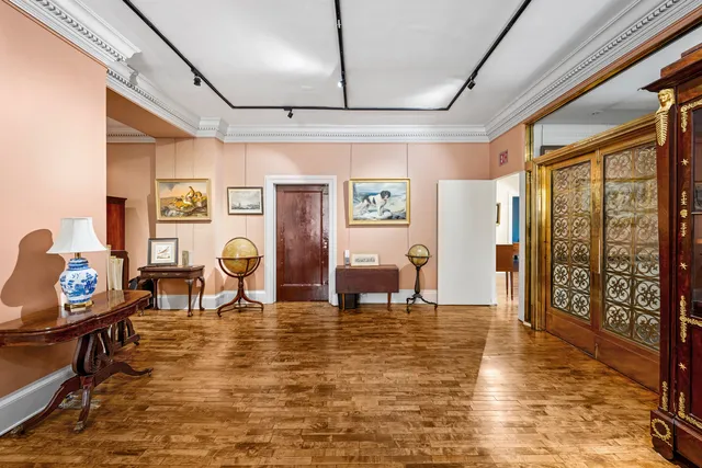 a living room with furniture rug and window