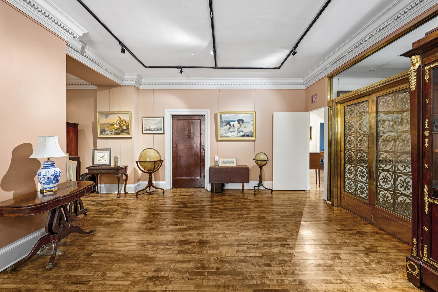 31 East 72nd Street, Unit 2 Manhattan, NY 10021 - Photo 6 of 12 a living room with furniture floor to ceiling window and wooden floor