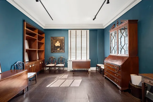 a room with furniture and a large window