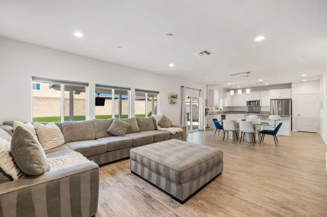 a kitchen with center island table and chairs