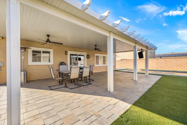 a view of house with backyard and porch