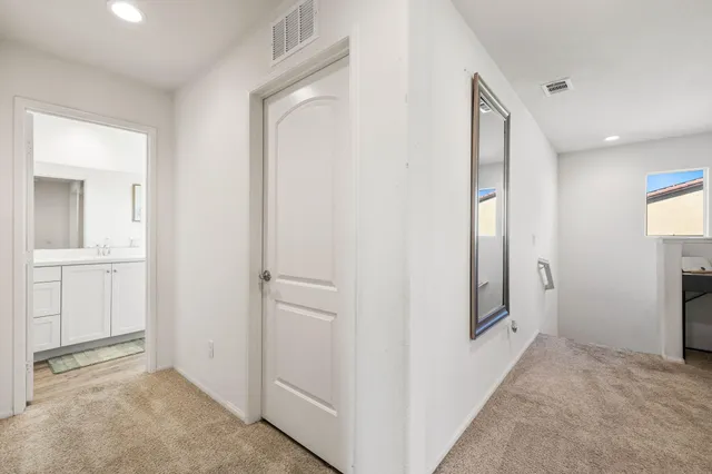 a view of a hallway with workspace
