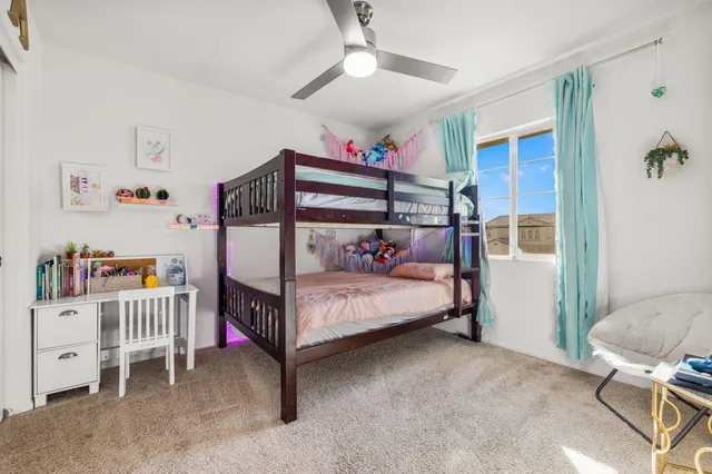 a spacious bathroom with a shower sink and mirror