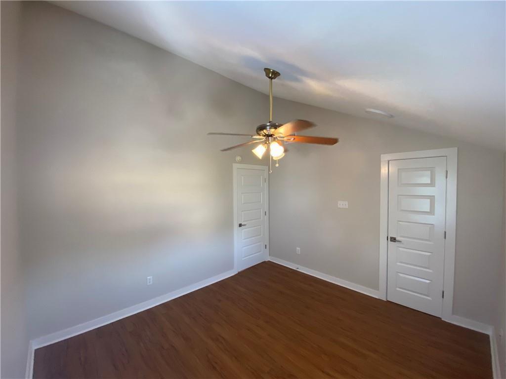 3506 Speedway, Unit 304 Austin, TX 78705 - Photo 4 of 7 a view of a room with wooden floor and ceiling fan
