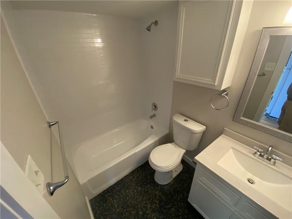 3506 Speedway, Unit 304 Austin, TX 78705 - Photo 5 of 7 a bathroom with a sink toilet and shower