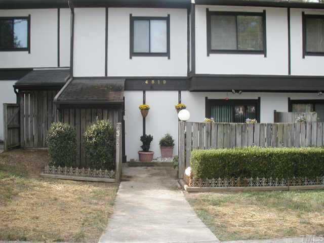 4319 Lake Ridge Drive, Unit 9B Raleigh, NC 27604 - Photo 1 of 10 a front view of a house with garden