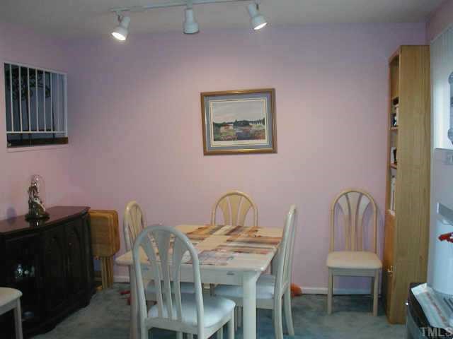 4319 Lake Ridge Drive, Unit 9B Raleigh, NC 27604 - Photo 4 of 10 a view of a dining room with furniture and wooden floor