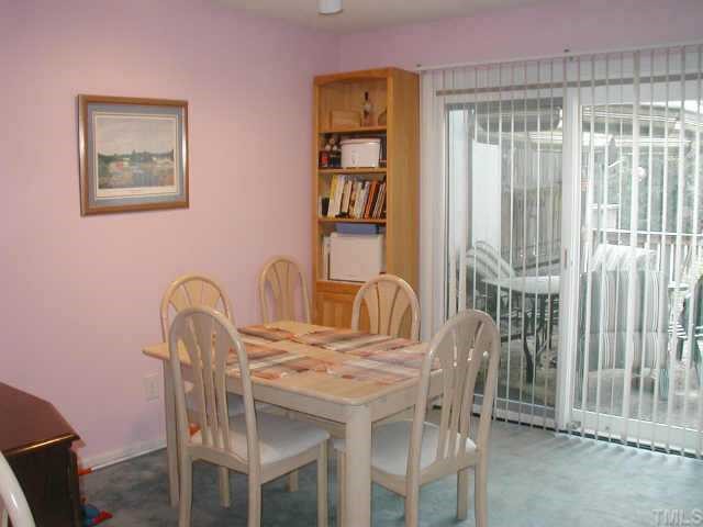 4319 Lake Ridge Drive, Unit 9B Raleigh, NC 27604 - Photo 5 of 10 a view of a dining room that has a table and chairs