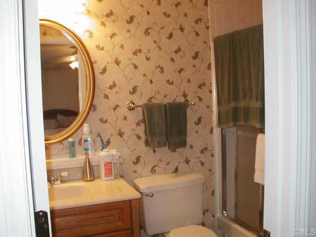 4319 Lake Ridge Drive, Unit 9B Raleigh, NC 27604 - Photo 7 of 10 a bathroom with a sink toilet and shower
