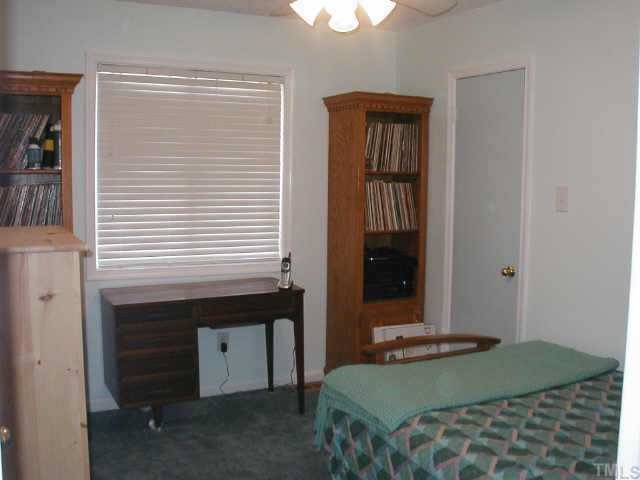 4319 Lake Ridge Drive, Unit 9B Raleigh, NC 27604 - Photo 9 of 10 a bedroom with a bed and a window