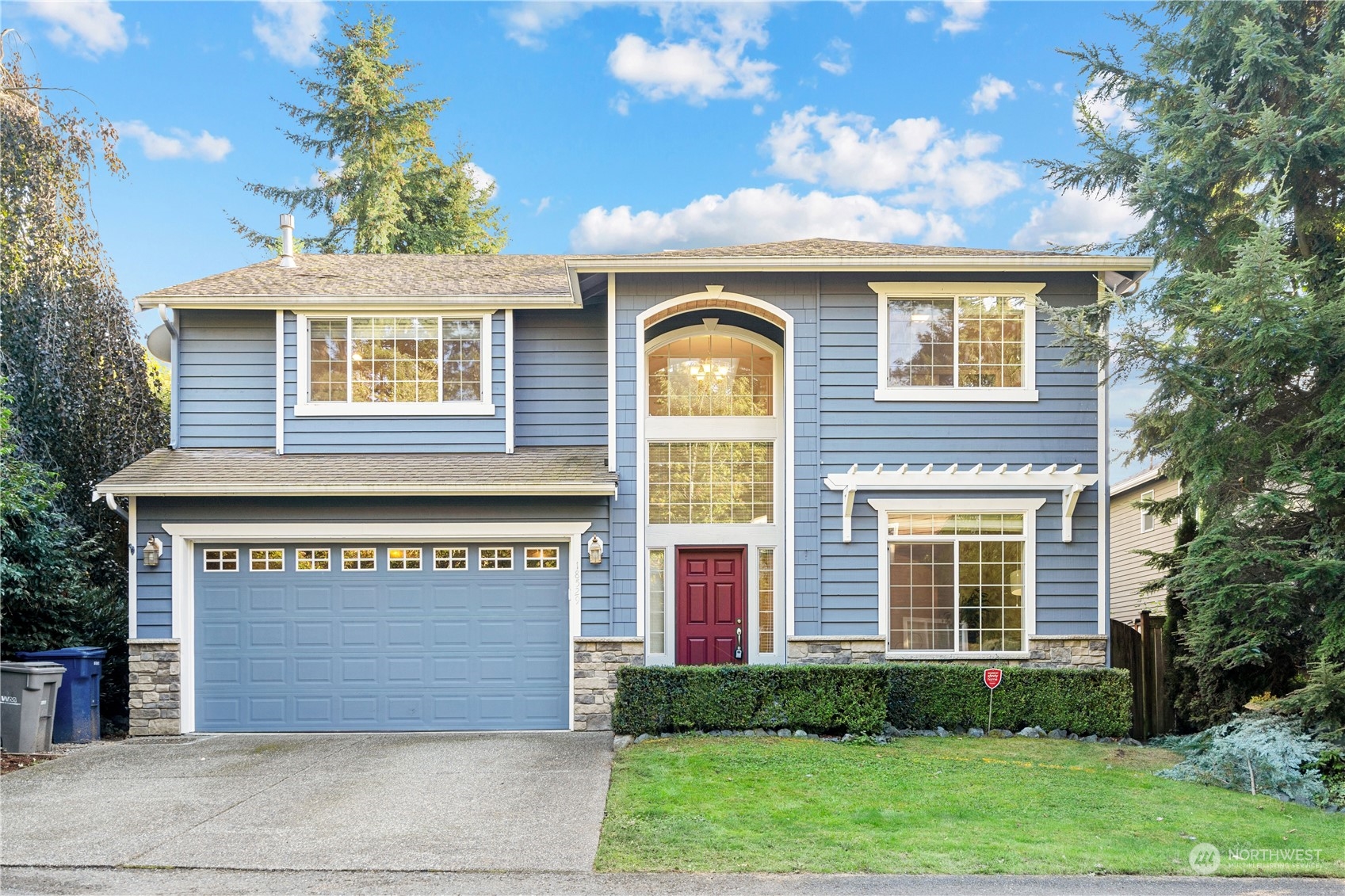 18529 33rd Avenue Southeast Bothell, WA 98012 - Photo 1 of 40 a front view of a house with a garden and plants