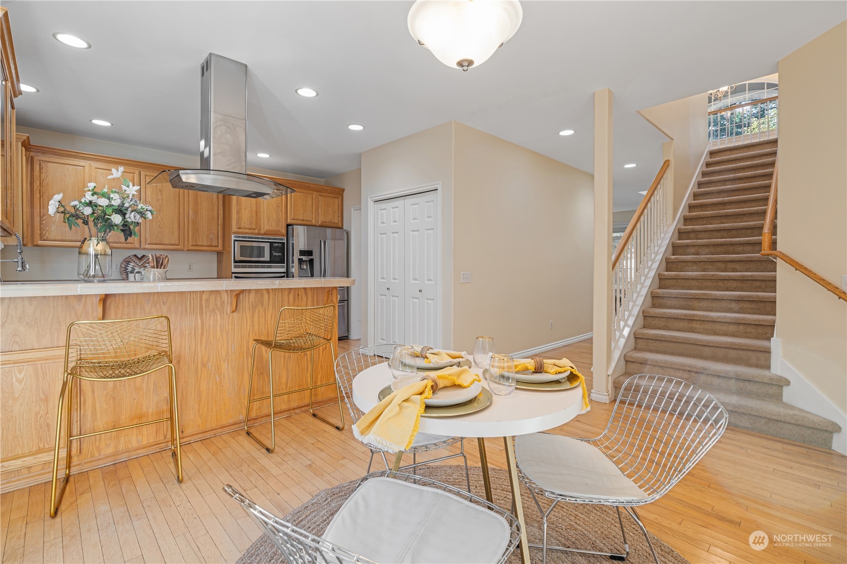 18529 33rd Avenue Southeast Bothell, WA 98012 - Photo 12 of 40 a kitchen with granite countertop white cabinets and chairs