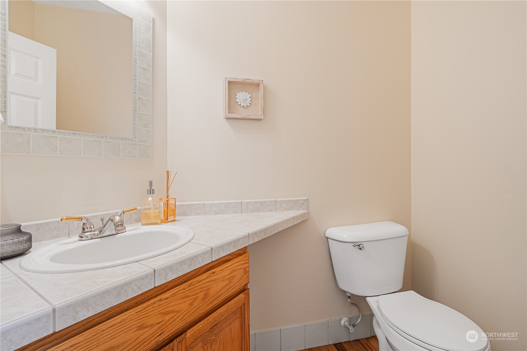 18529 33rd Avenue Southeast Bothell, WA 98012 - Photo 17 of 40 a bathroom with a sink a toilet and a mirror