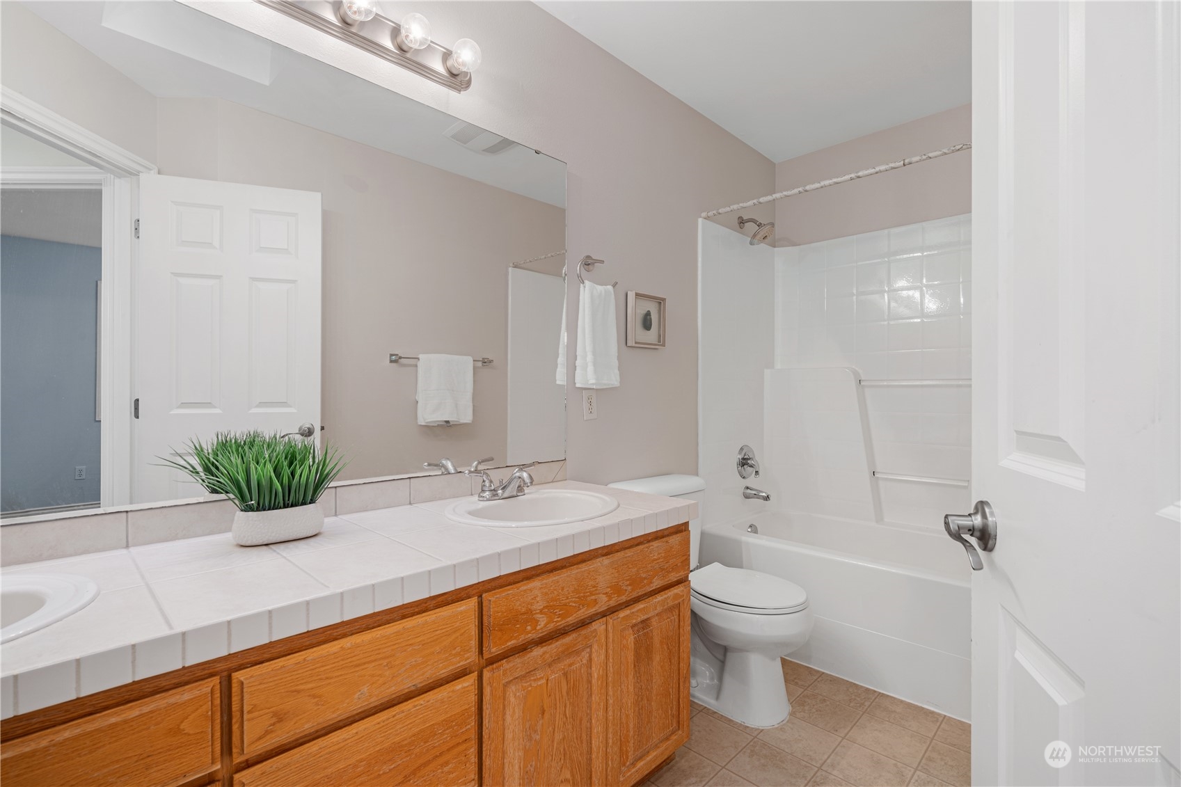 18529 33rd Avenue Southeast Bothell, WA 98012 - Photo 30 of 40 a bathroom with a granite countertop sink a toilet and shower