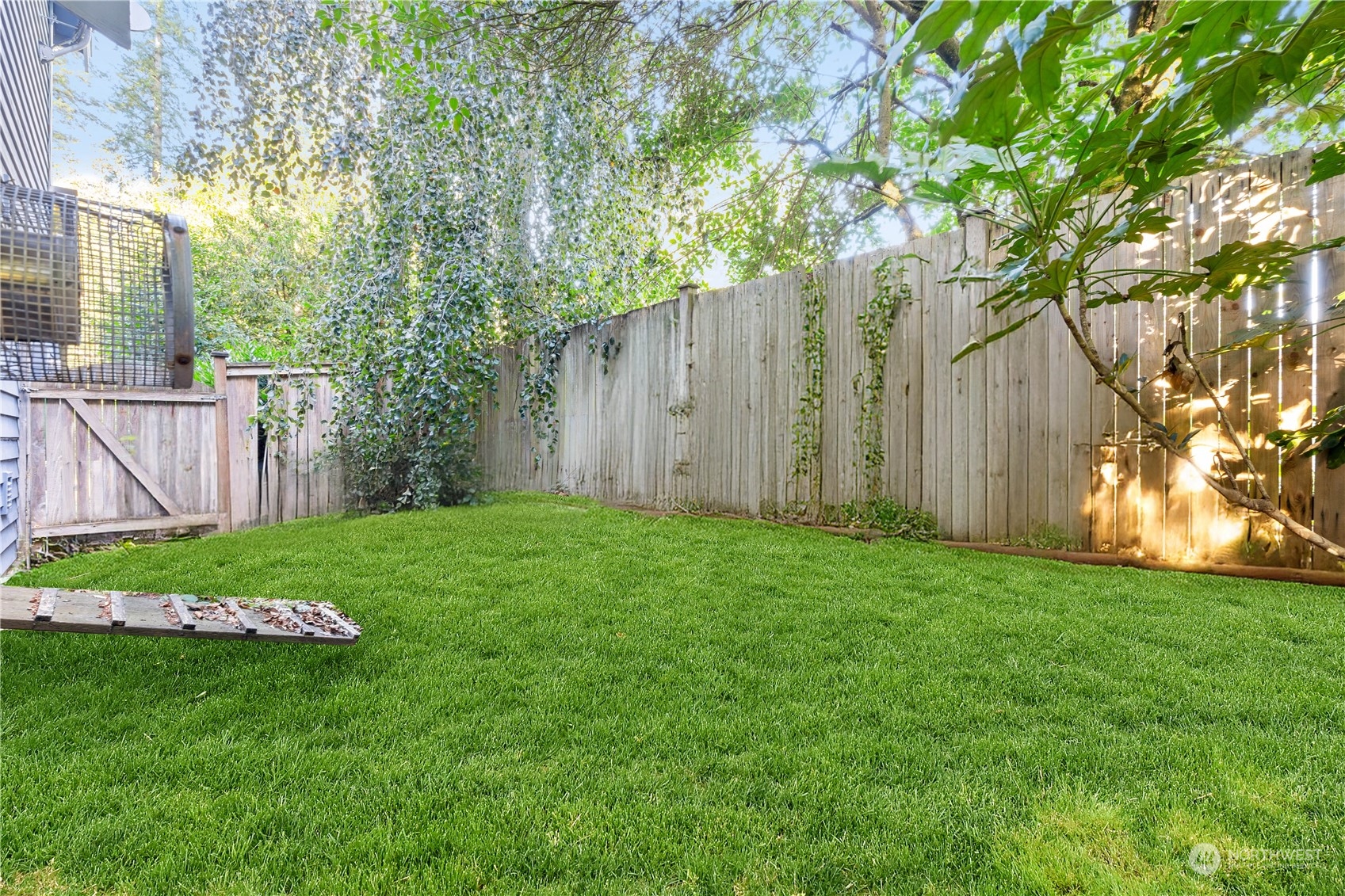 18529 33rd Avenue Southeast Bothell, WA 98012 - Photo 38 of 40 a view of a backyard with large trees and wooden fence