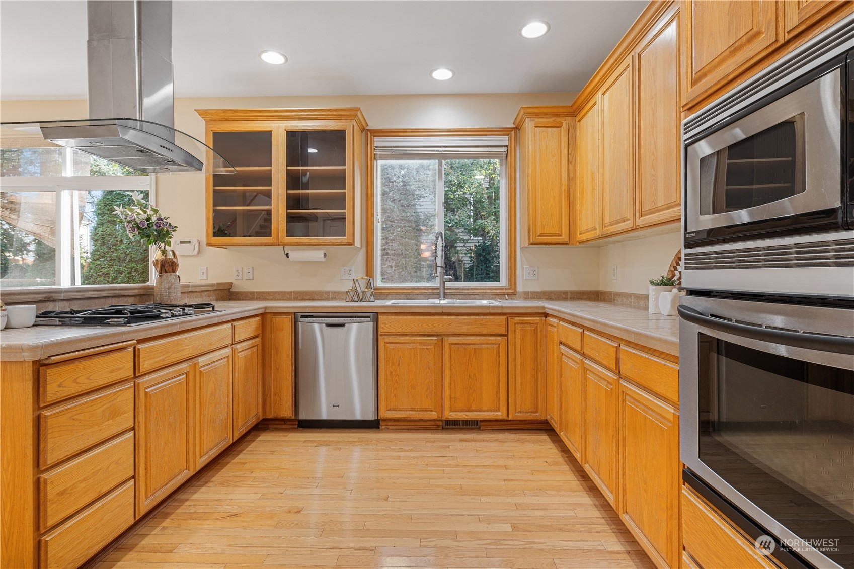 18529 33rd Avenue Southeast Bothell, WA 98012 - Photo 9 of 40 a kitchen with stainless steel appliances granite countertop a stove a sink and a microwave