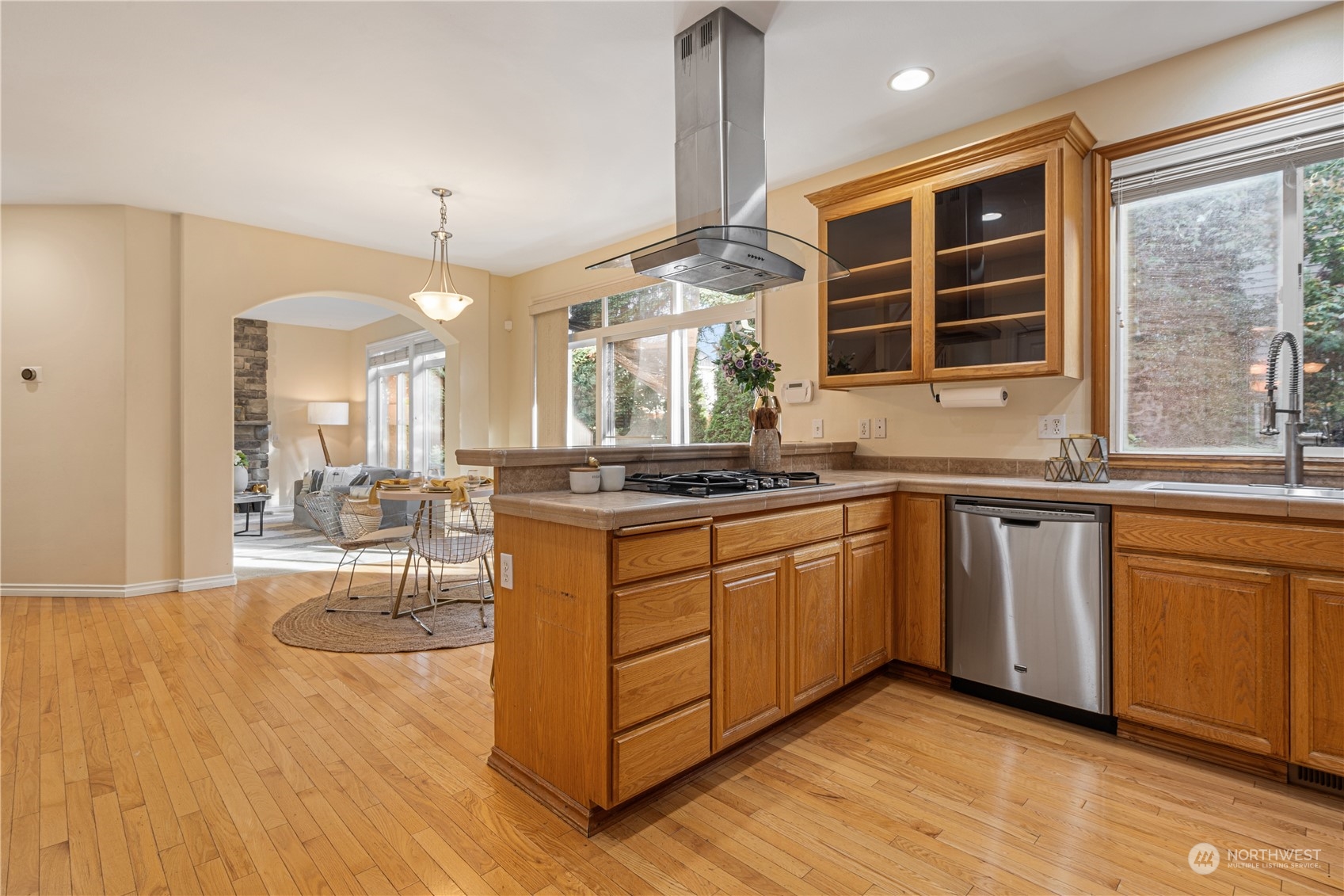 18529 33rd Avenue Southeast Bothell, WA 98012 - Photo 10 of 40 a kitchen with stainless steel appliances granite countertop a stove a sink and a refrigerator