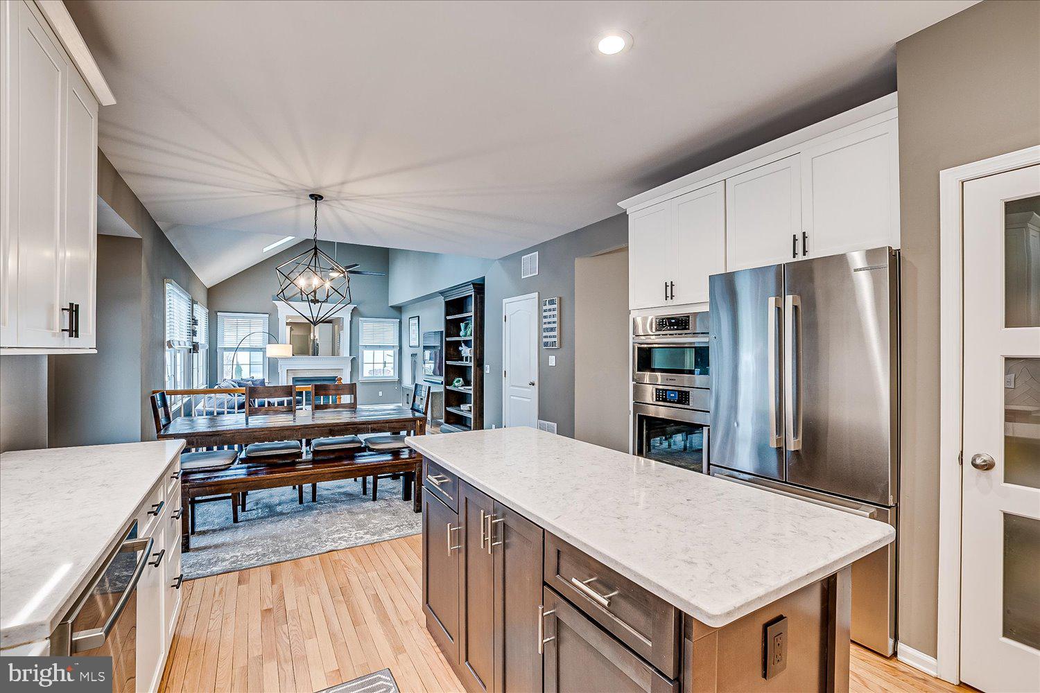 30 Witmer Way Robbinsville, NJ 08691 - Photo 16 of 48 a large kitchen with a table chairs refrigerator and cabinets