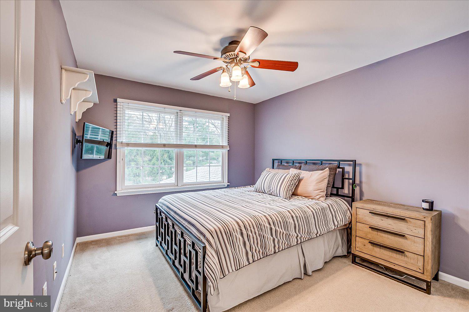 30 Witmer Way Robbinsville, NJ 08691 - Photo 32 of 48 a bedroom with a bed and a chandelier