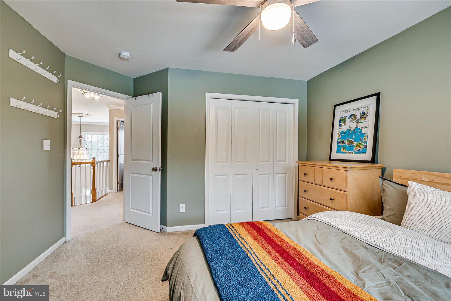 30 Witmer Way Robbinsville, NJ 08691 - Photo 34 of 48 a bedroom with a bed and a chandelier