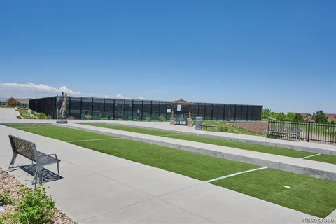 a view of grassy field with playground