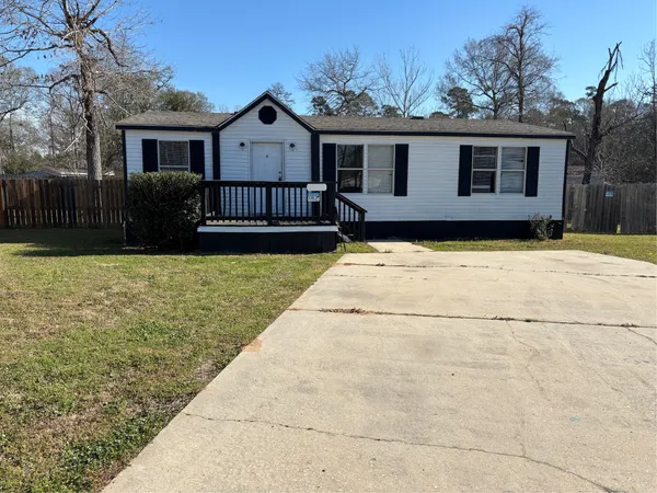 a front view of a house with yard