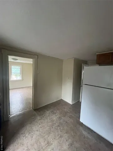 a view of empty room with closet