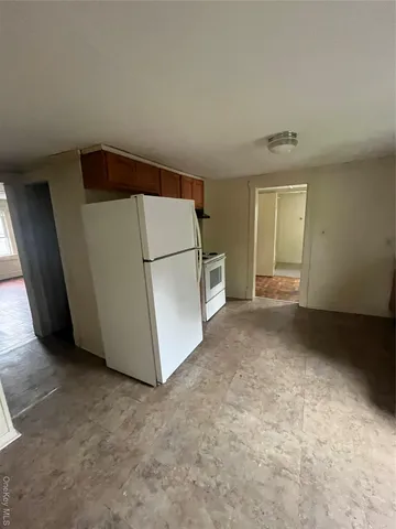 a view of a storage & utility room with a washer dryer