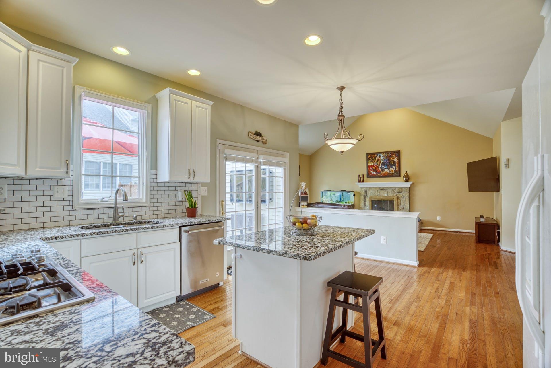 10855 Hunter Gate Way Reston, VA 20194 - Photo 11 of 57 a kitchen with sink refrigerator and stove