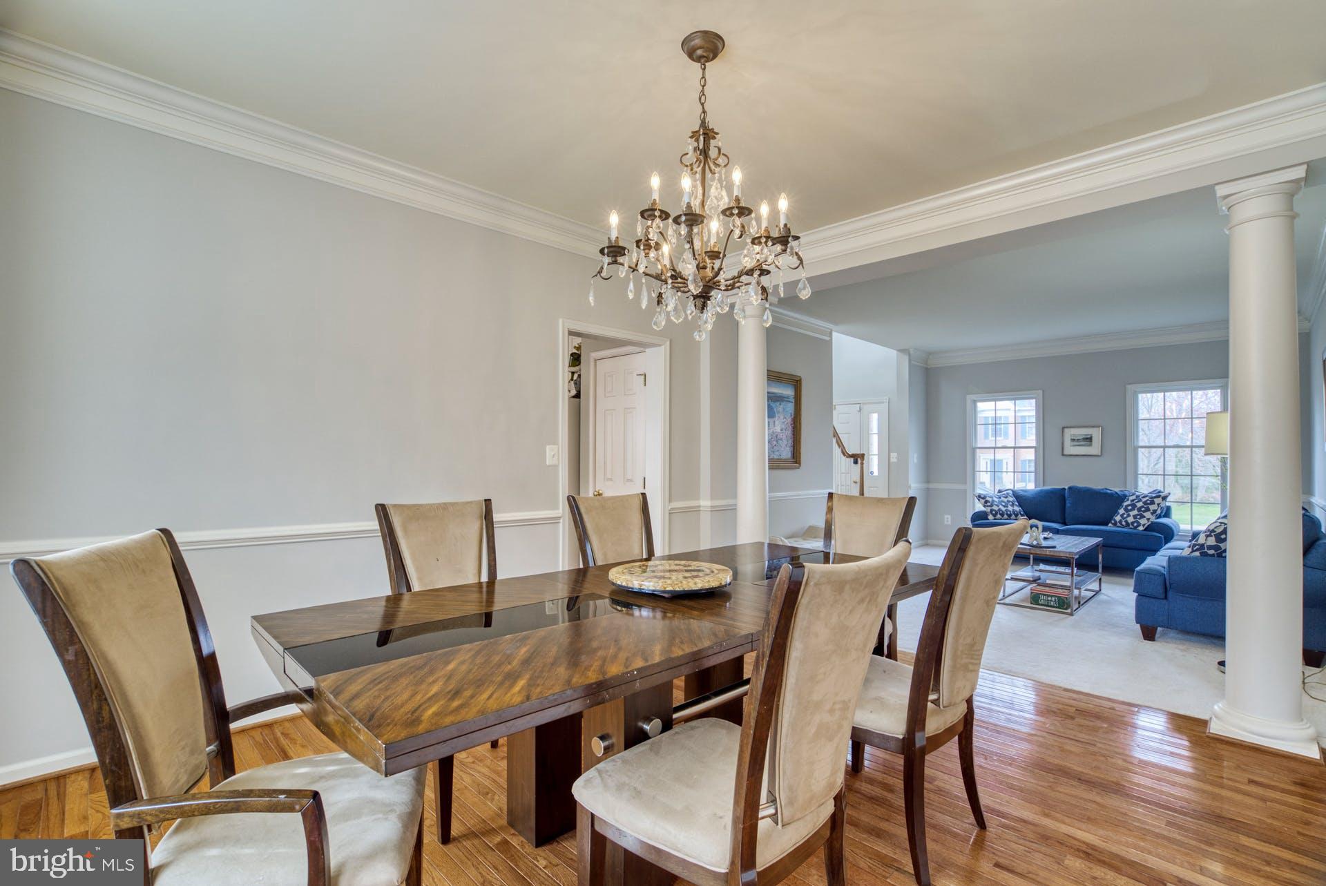 10855 Hunter Gate Way Reston, VA 20194 - Photo 15 of 57 a view of a dining room with furniture and wooden floor