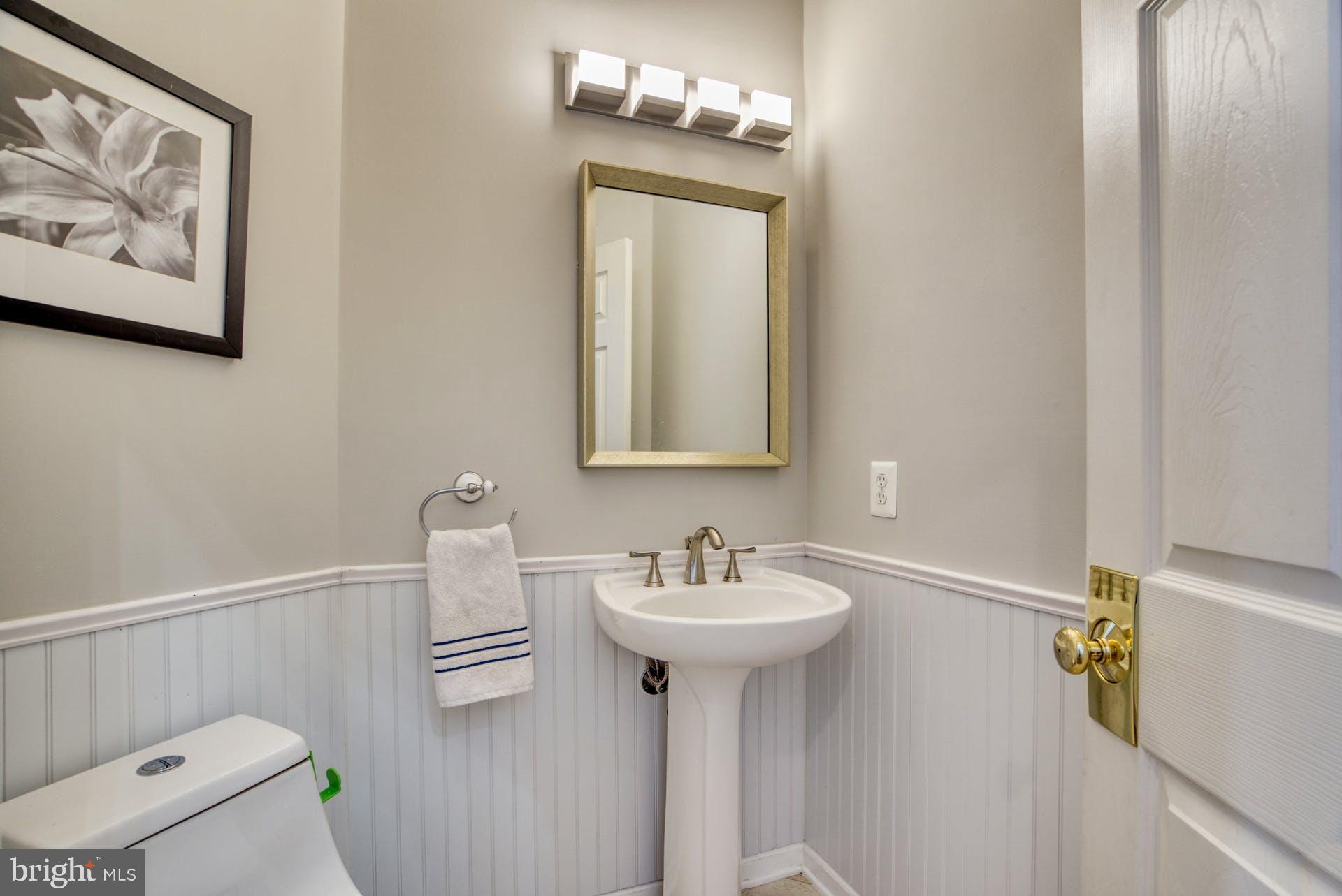 10855 Hunter Gate Way Reston, VA 20194 - Photo 16 of 57 a bathroom with a sink mirror and toilet