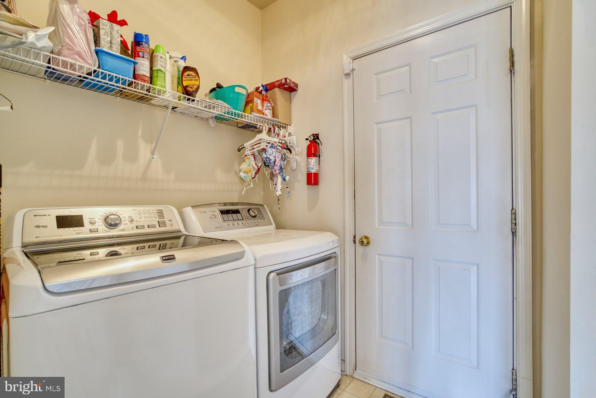 10855 Hunter Gate Way Reston, VA 20194 - Photo 17 of 57 a utility room with dryer and washer