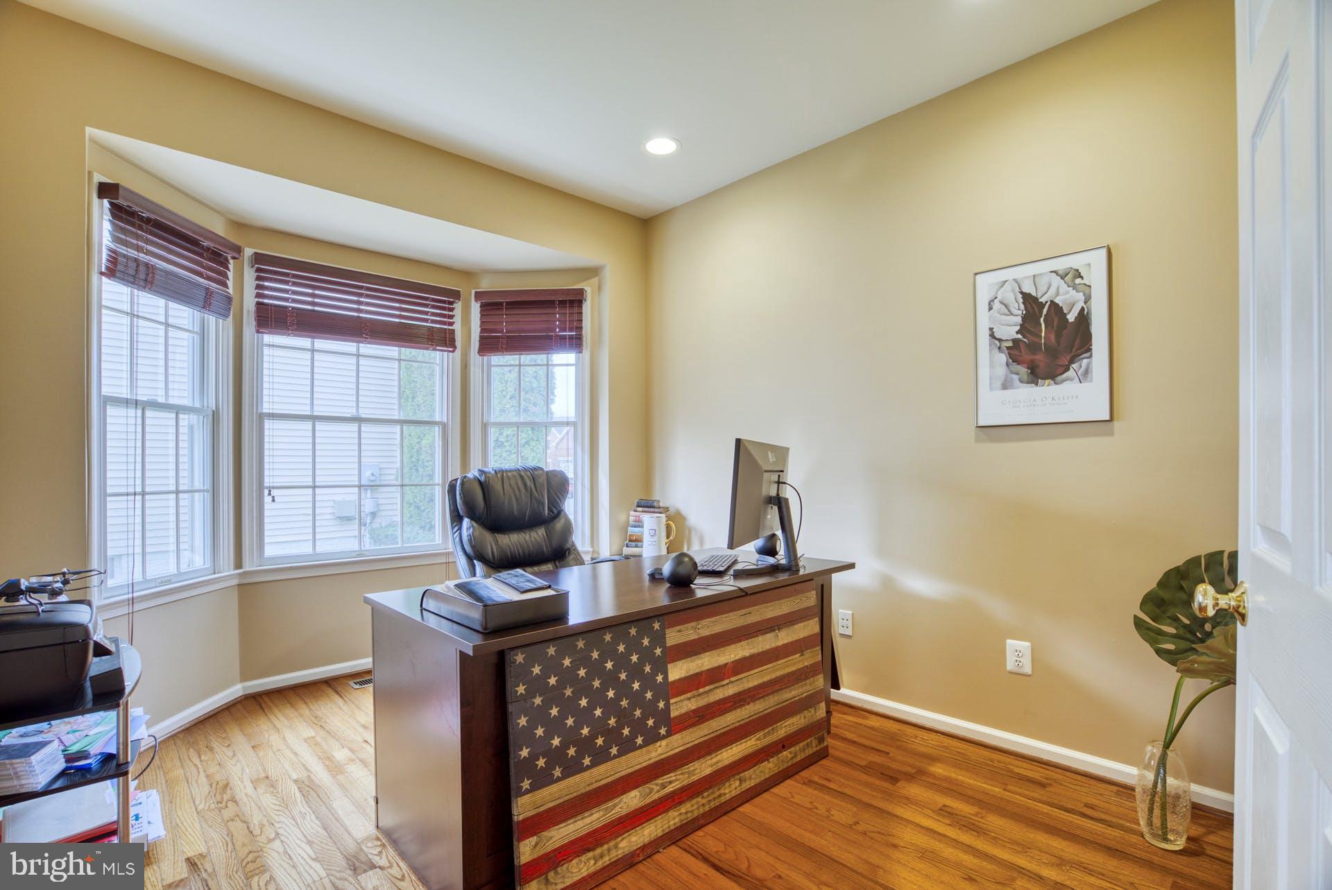 10855 Hunter Gate Way Reston, VA 20194 - Photo 18 of 57 a living room with furniture and a window
