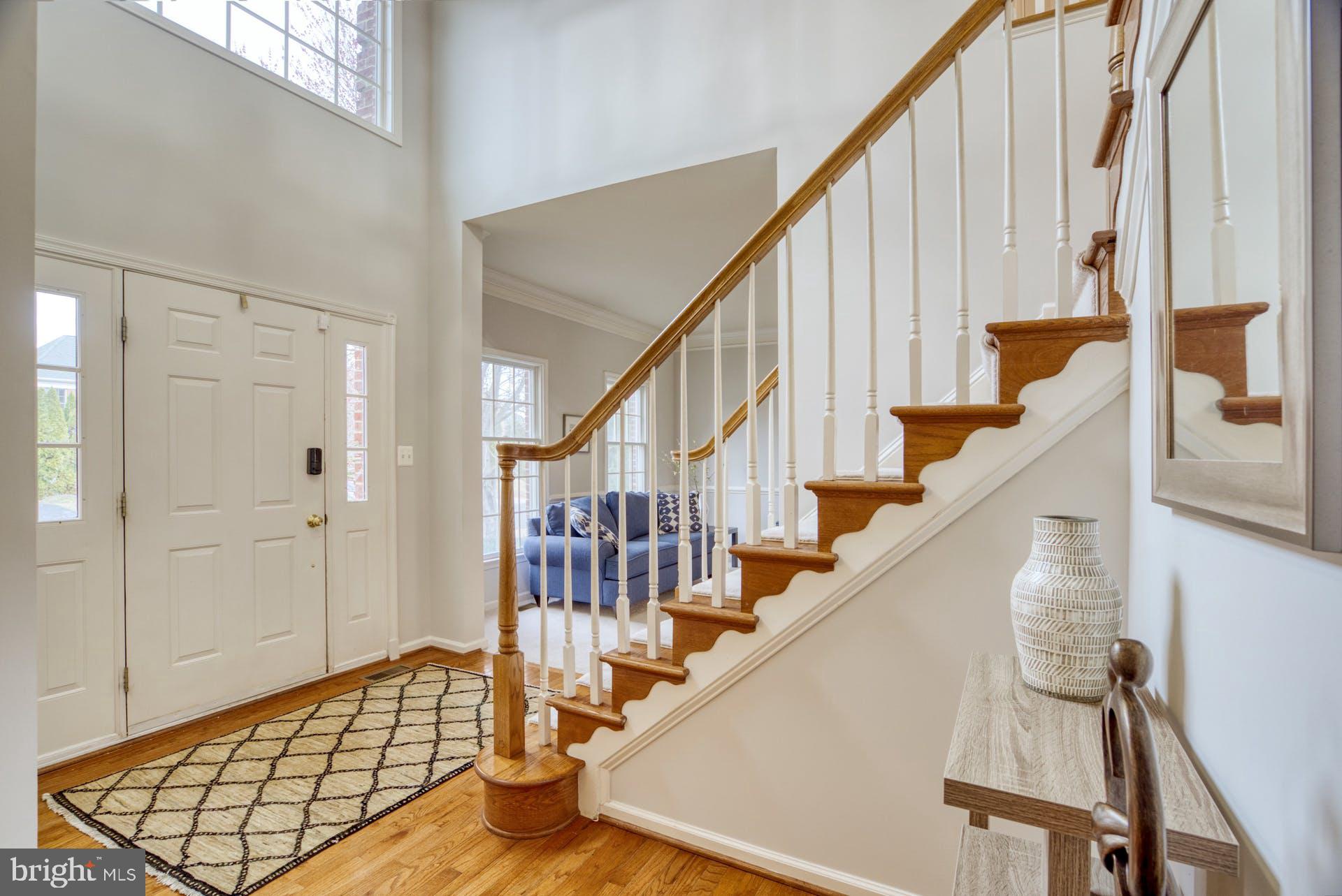 10855 Hunter Gate Way Reston, VA 20194 - Photo 3 of 57 a view of entryway with wooden floor and stairs
