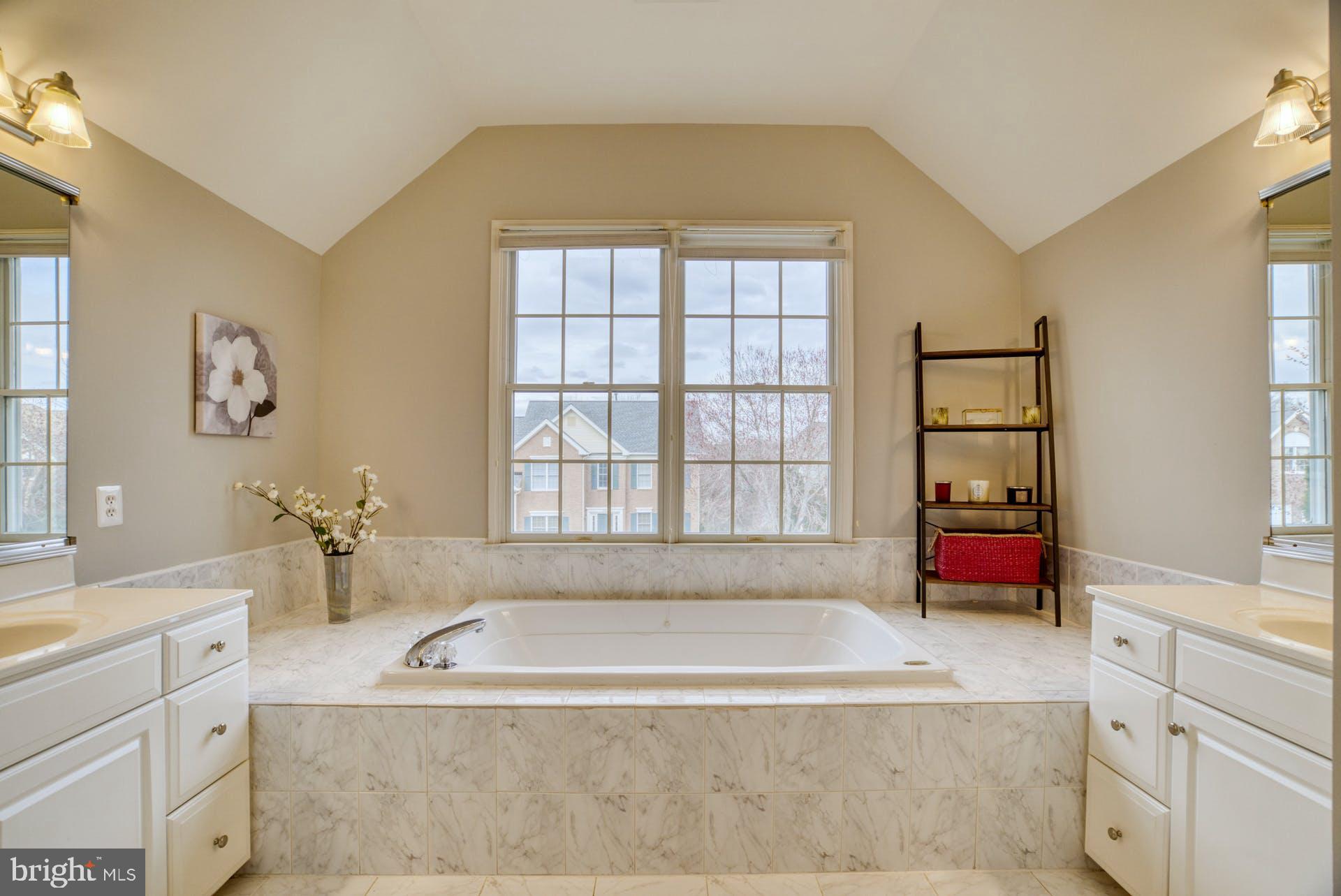 10855 Hunter Gate Way Reston, VA 20194 - Photo 24 of 57 a spacious bathroom with sink and bathtub