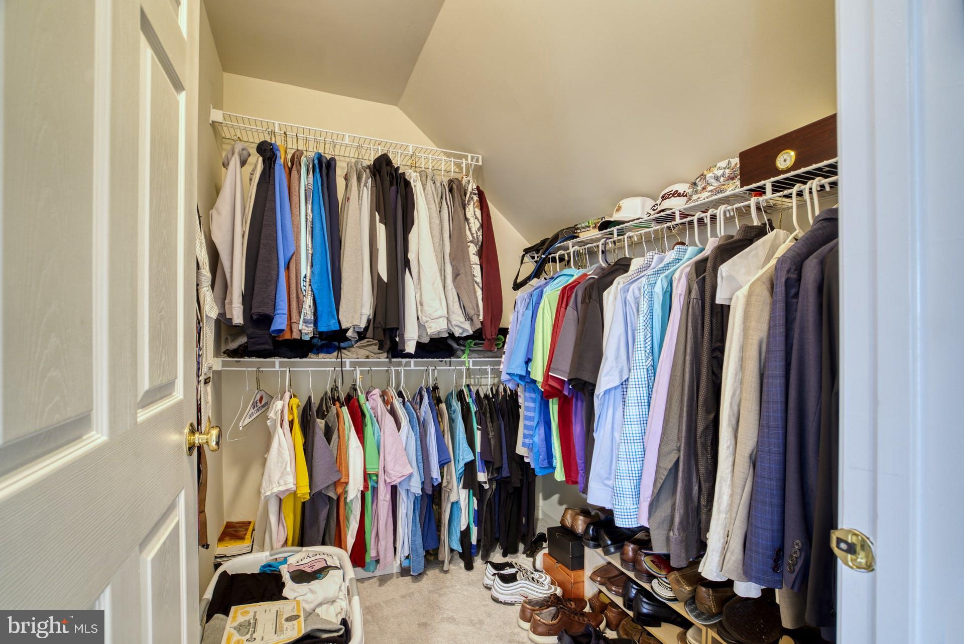 10855 Hunter Gate Way Reston, VA 20194 - Photo 26 of 57 a view of walk in closet with clothes