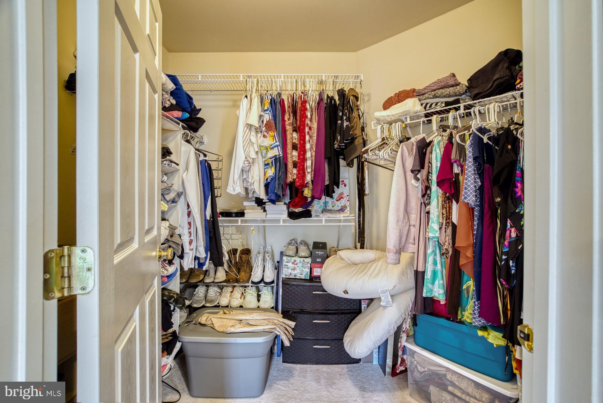 10855 Hunter Gate Way Reston, VA 20194 - Photo 27 of 57 a view of walk in closet with clothes and shoes