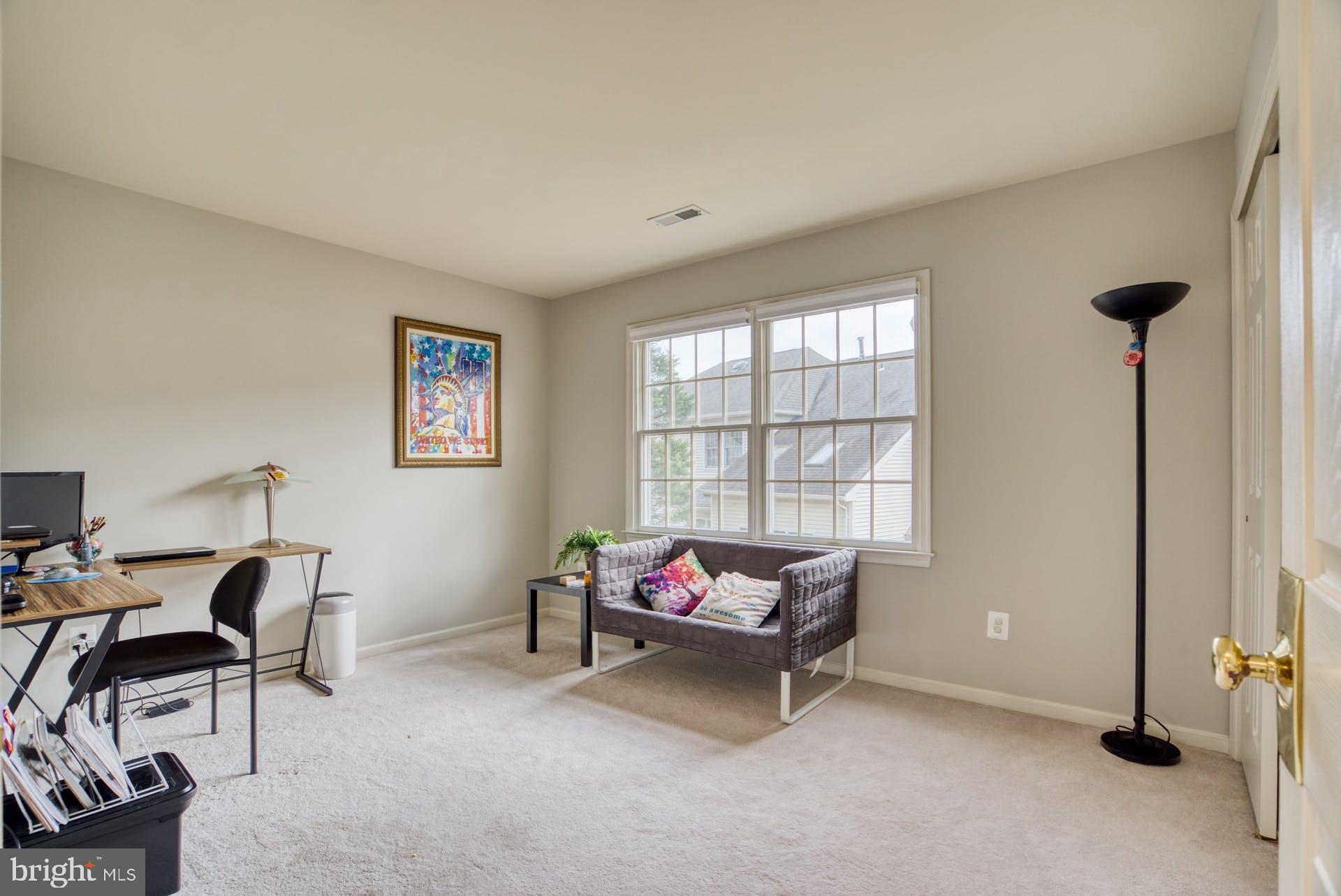 10855 Hunter Gate Way Reston, VA 20194 - Photo 29 of 57 a living room with furniture and a window