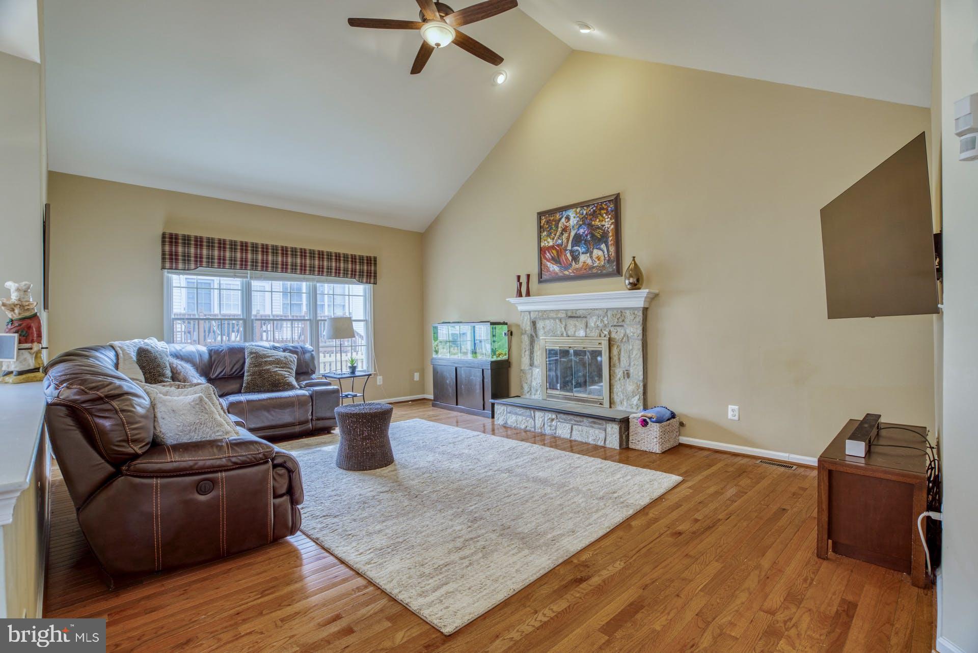 10855 Hunter Gate Way Reston, VA 20194 - Photo 4 of 57 a living room with furniture and a fireplace
