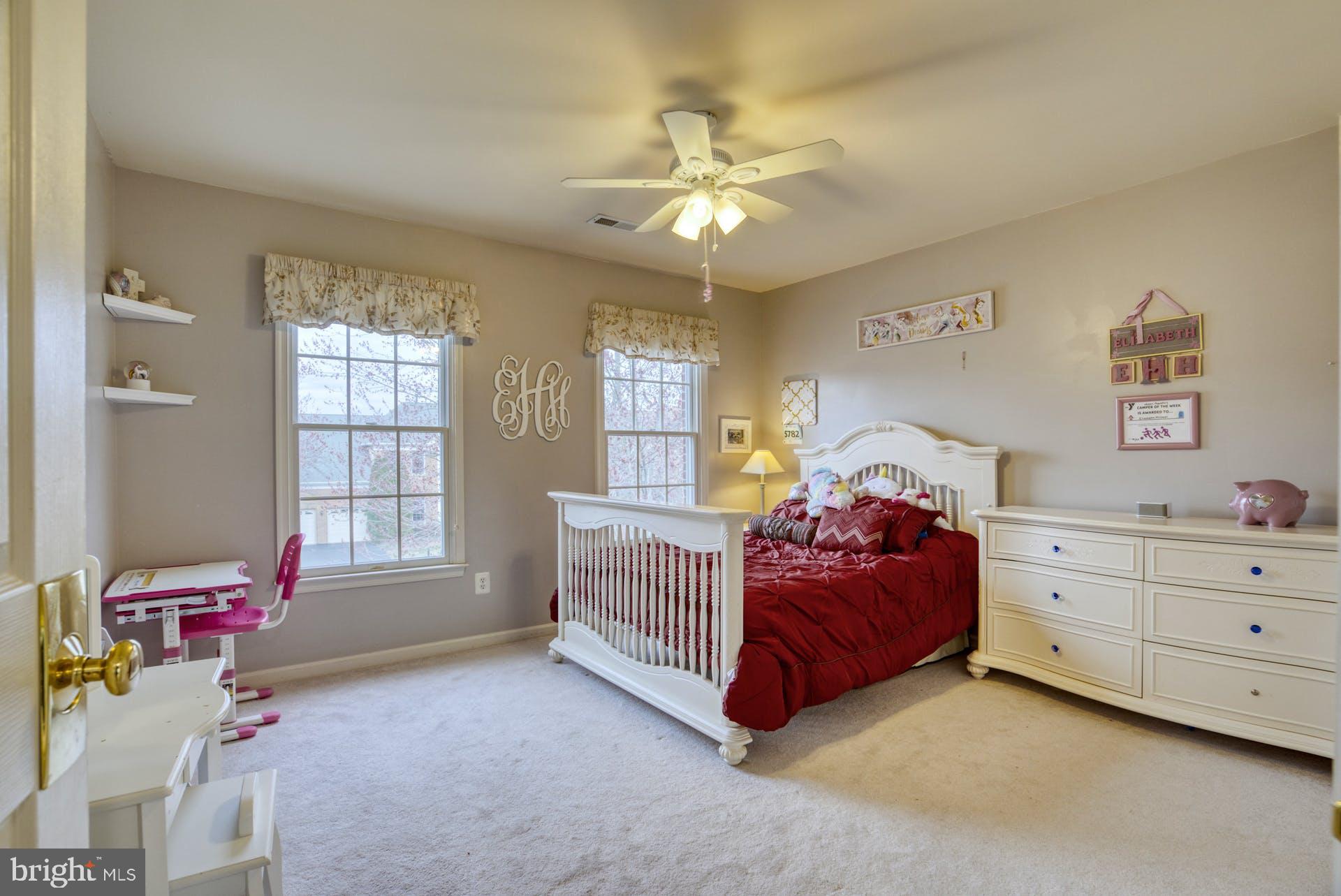 10855 Hunter Gate Way Reston, VA 20194 - Photo 31 of 57 a living room with a bed and a window