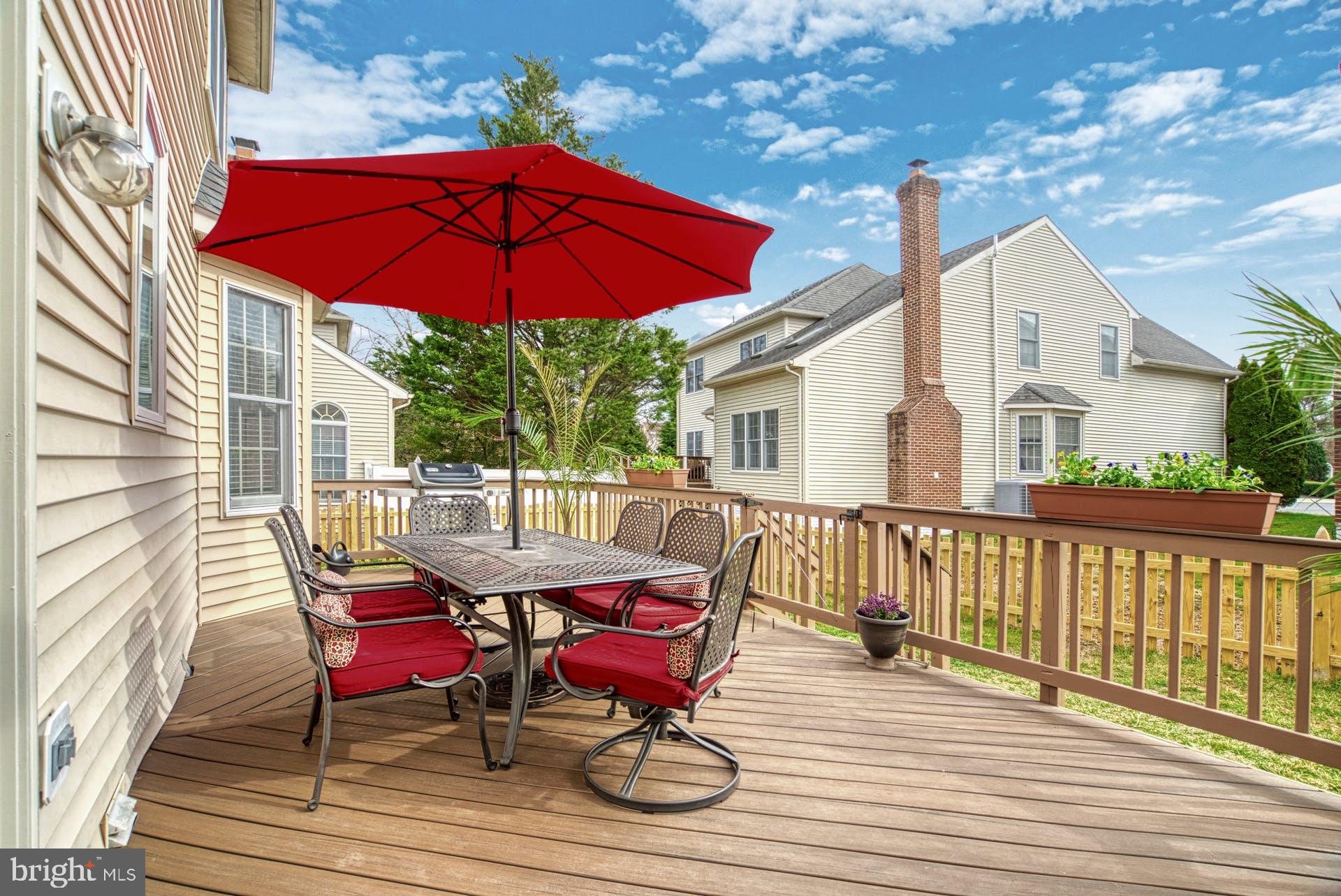 10855 Hunter Gate Way Reston, VA 20194 - Photo 39 of 57 a view of a house with a patio and wooden floor