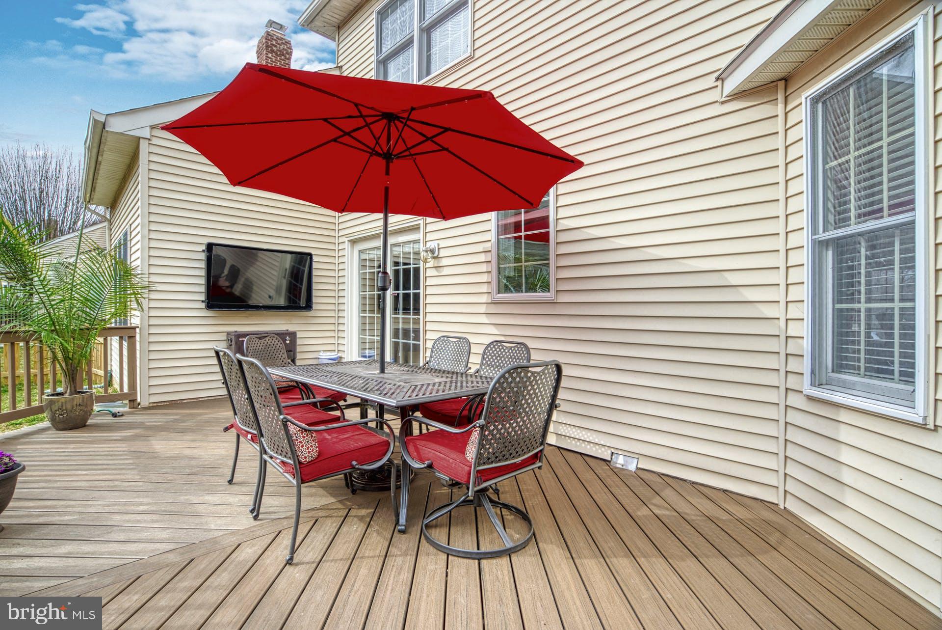 10855 Hunter Gate Way Reston, VA 20194 - Photo 41 of 57 a view of a roof deck with wooden floor and seating space