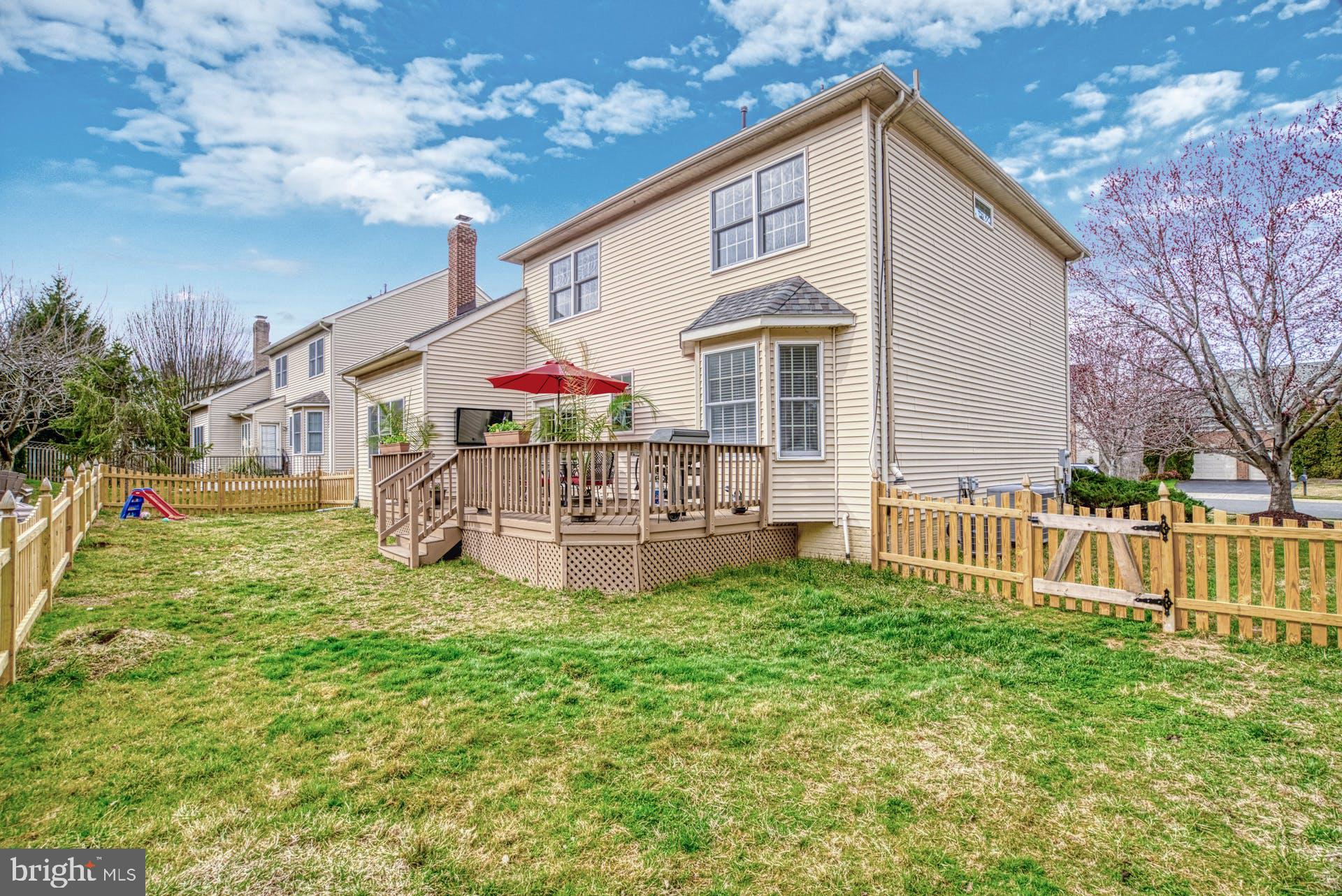 10855 Hunter Gate Way Reston, VA 20194 - Photo 42 of 57 a view of a house with a yard and sitting area