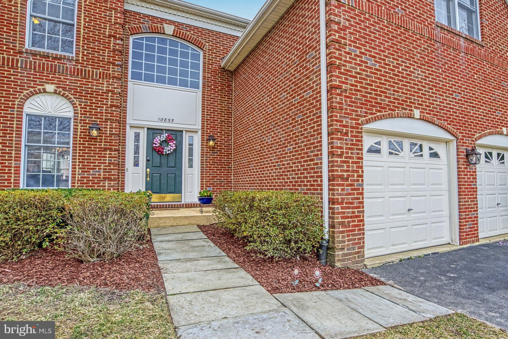 10855 Hunter Gate Way Reston, VA 20194 - Photo 44 of 57 a view of a brick house with plants