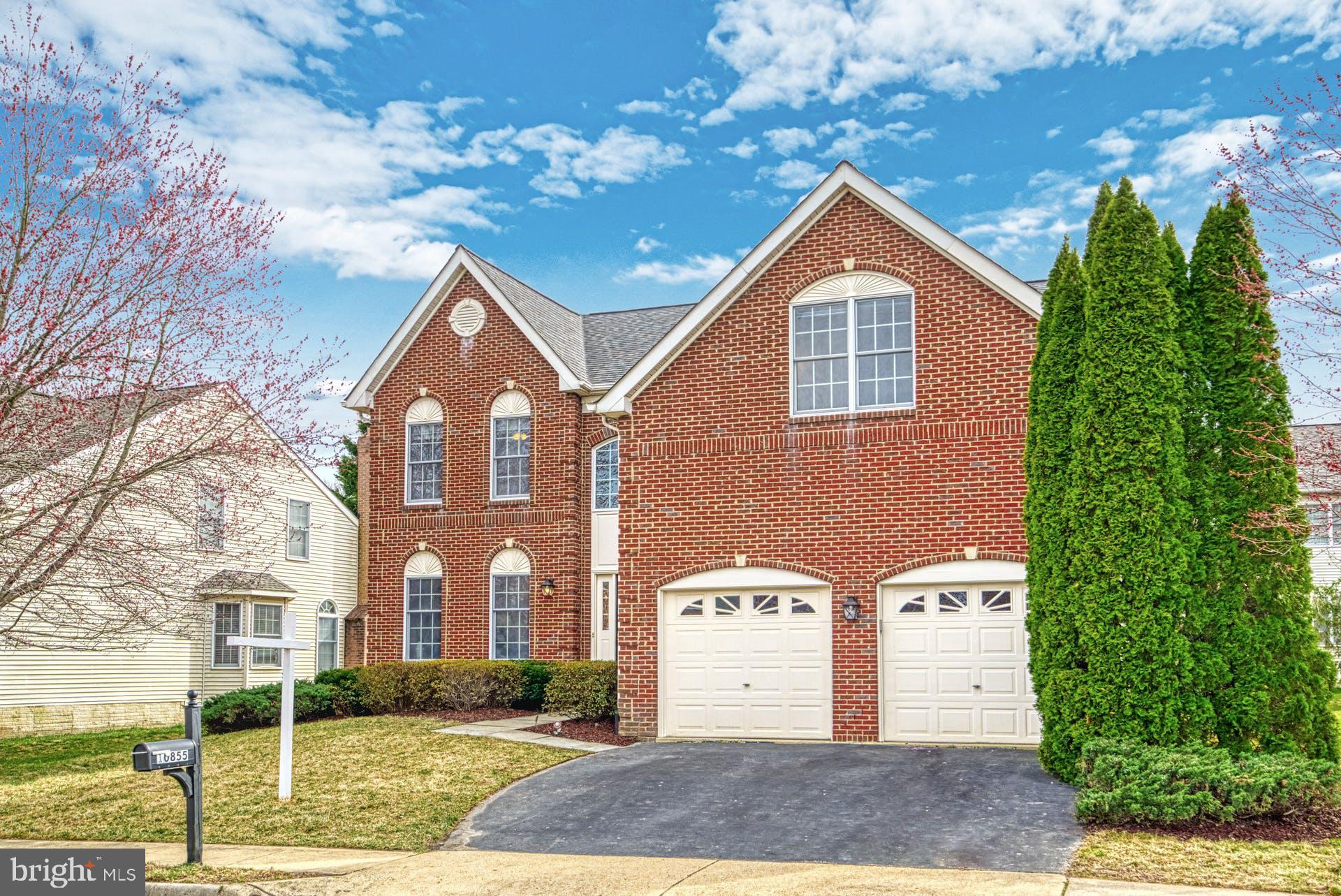 10855 Hunter Gate Way Reston, VA 20194 - Photo 45 of 57 a front view of a house with a yard