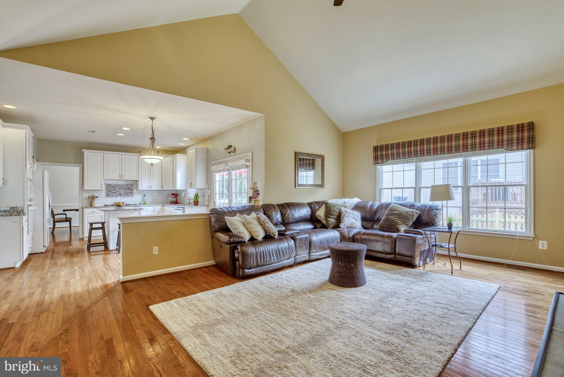 10855 Hunter Gate Way Reston, VA 20194 - Photo 6 of 57 a living room with furniture and a large window